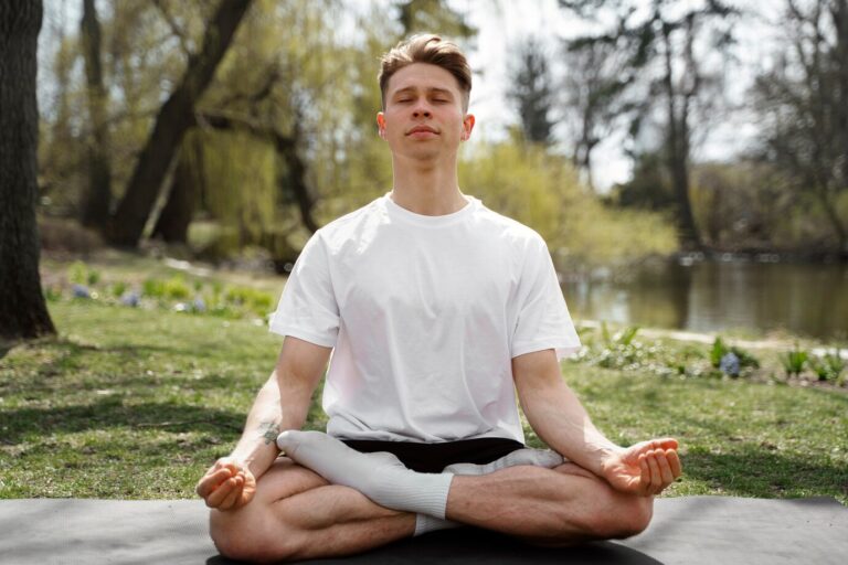 full-shot-man-meditating-outdoors_23-2149409953