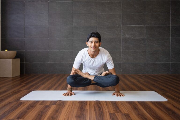 smiling-yogi-doing-scale-yoga-pose-gym_1262-16426