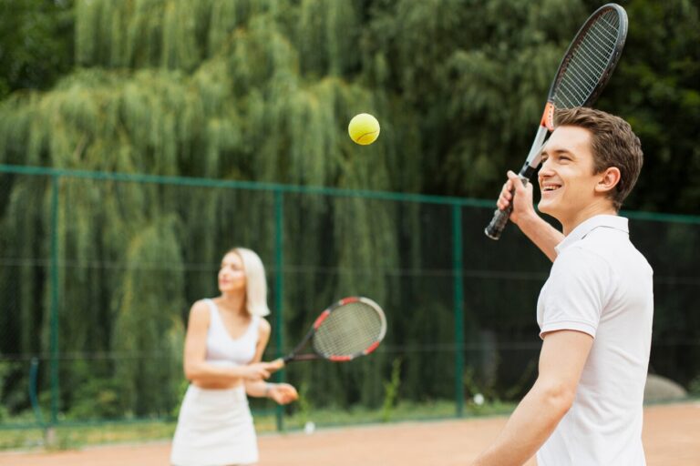 young-man-woman-playing-tennis_23-2148277725