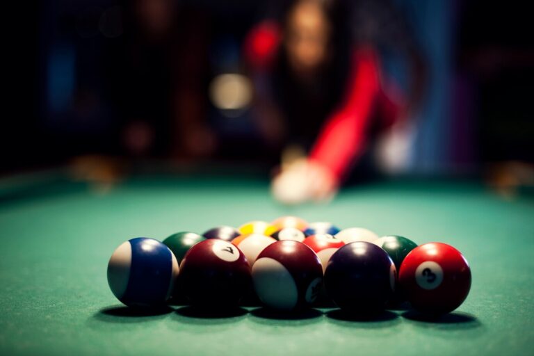 young-woman-playing-billiard_329181-2814